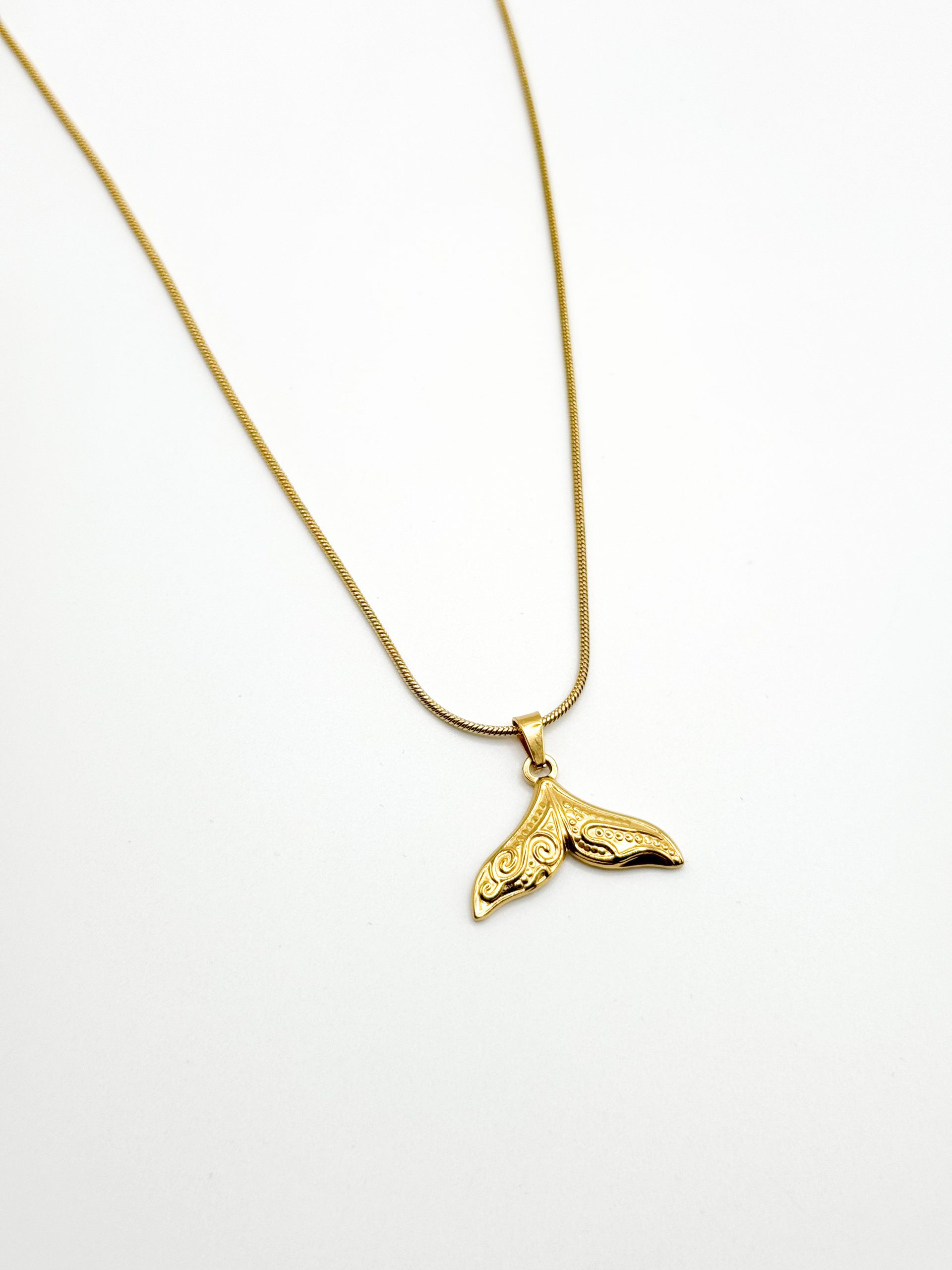 Gold whale tail pendant necklace